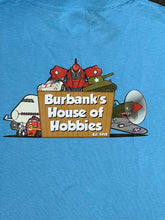 Load image into Gallery viewer, Burbank's House of Hobbies "Light Blue w/ Logo" T-Shirt