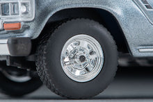 Load image into Gallery viewer, Tomytec 1/64 Toyota Land Cruiser 60 North American Spec Light Blue/Gray) 1988 320487